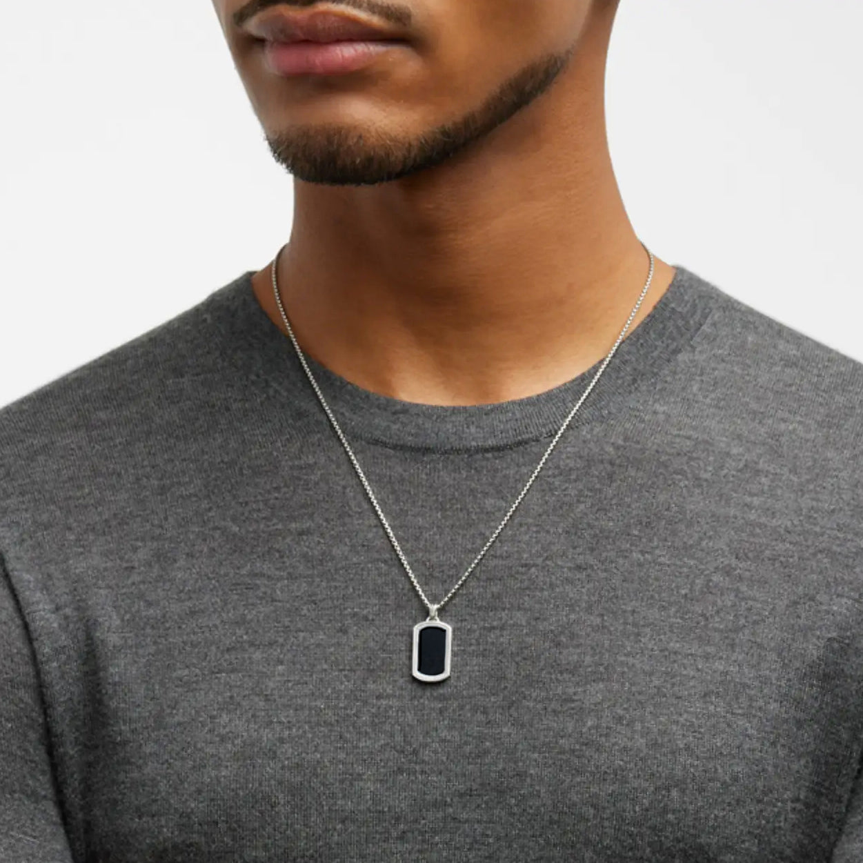 Male model wearing the Black Onyx Gemstone Plaque Sterling Silver Pendant Necklace. 