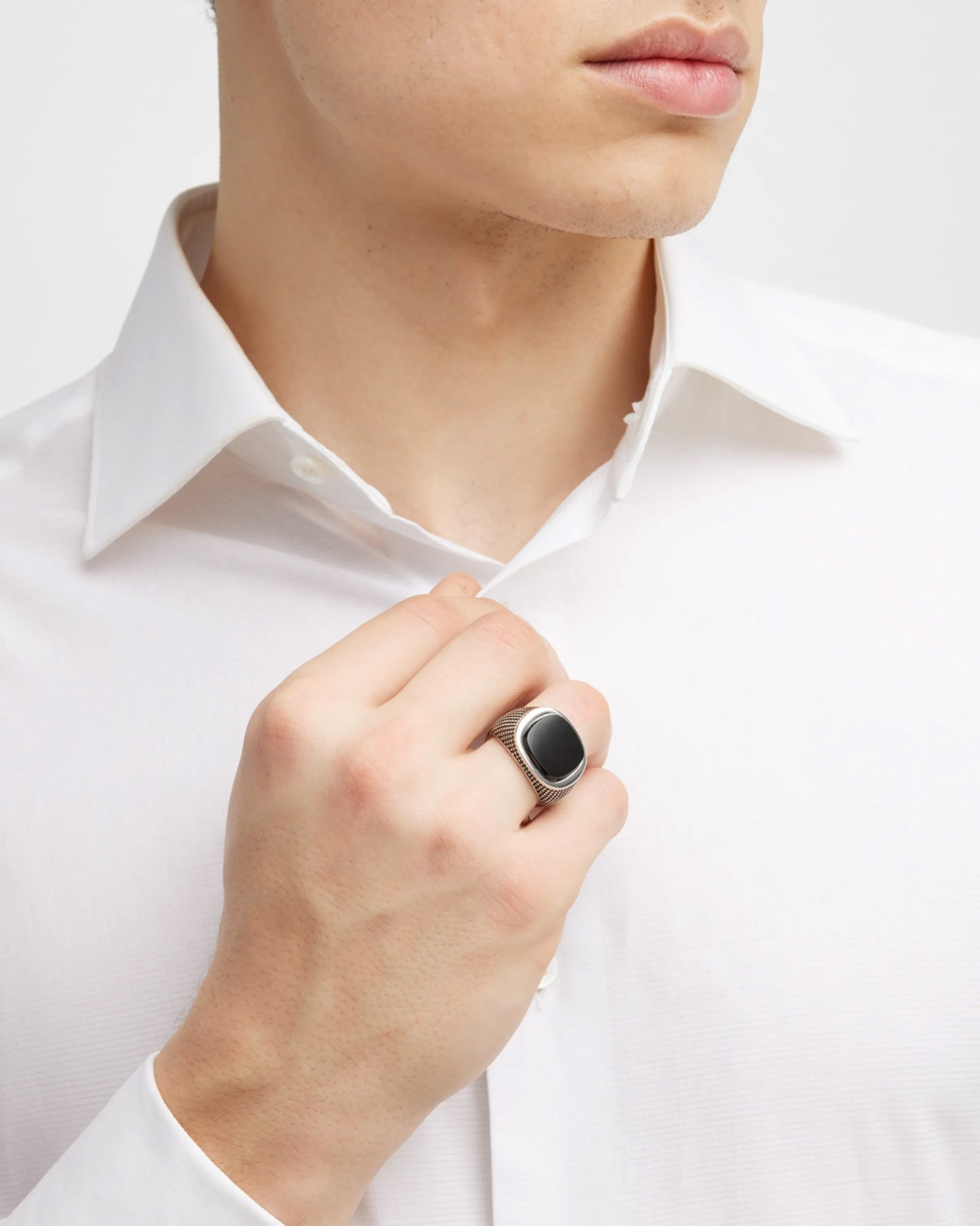 Male model wearing the Cross Etched Black Onyx Sterling Silver Ring. 