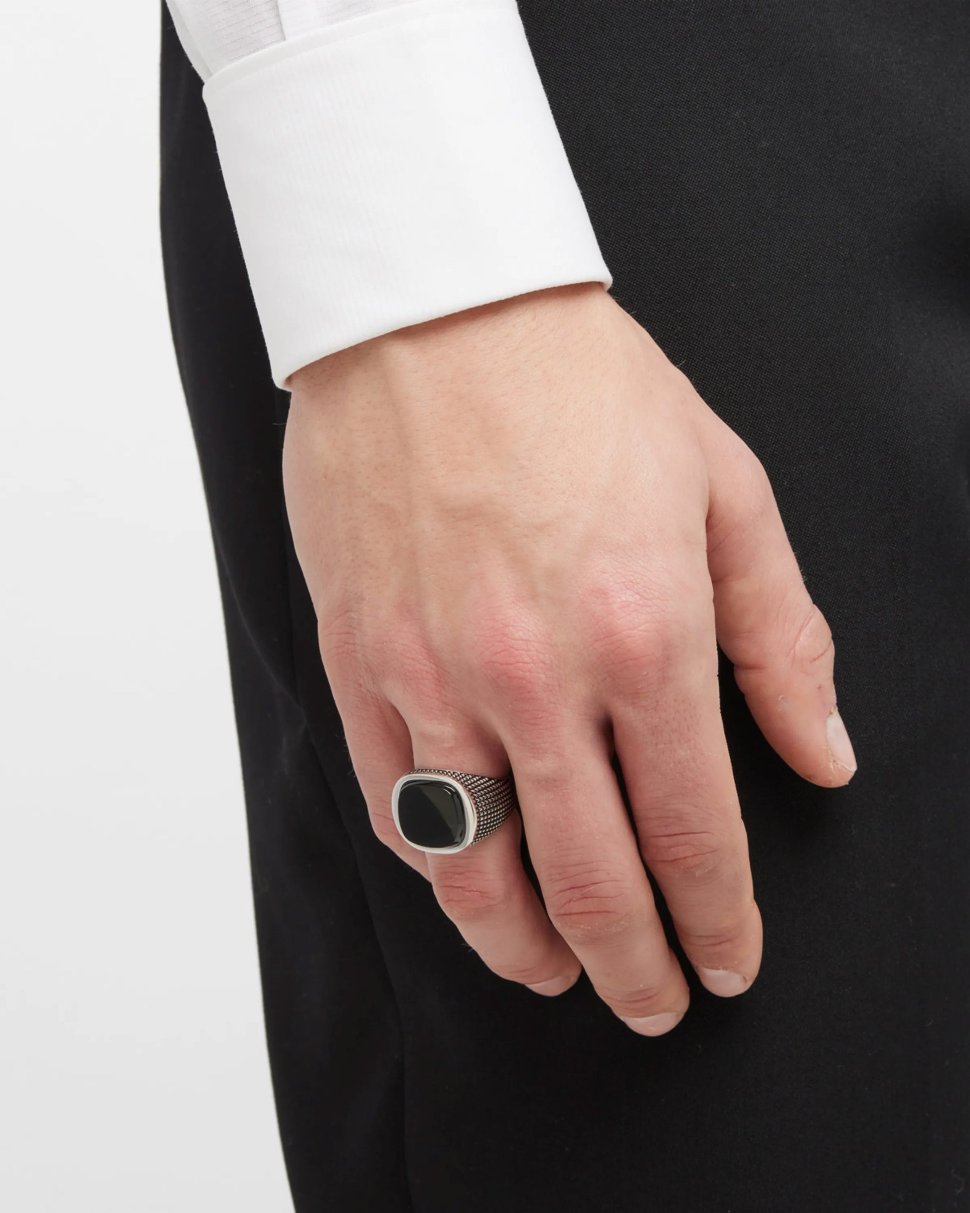 Male model wearing the Cross Etched Black Onyx Sterling Silver Ring. 