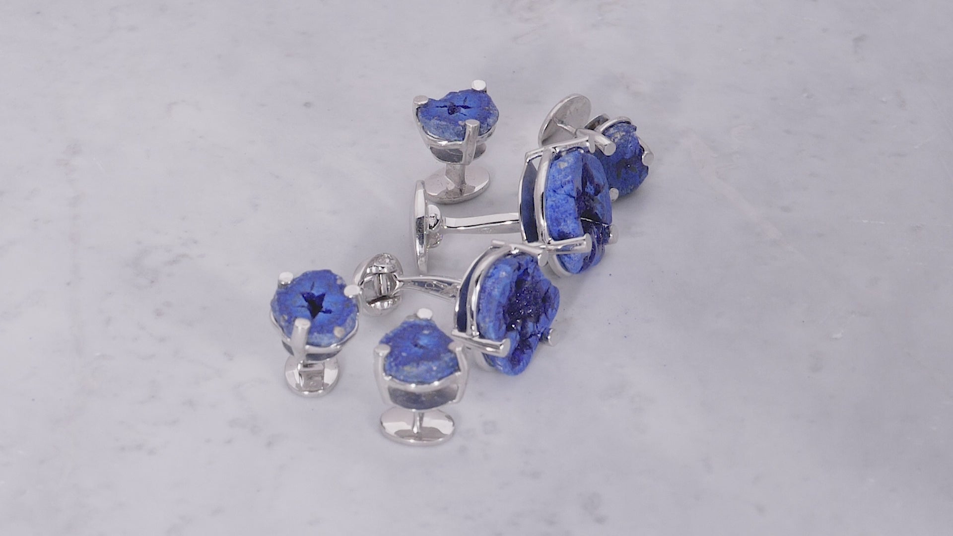 180 degree video of Azurite Geode Sterling Silver Cufflinks and Tuxedo Studs on marble background. 