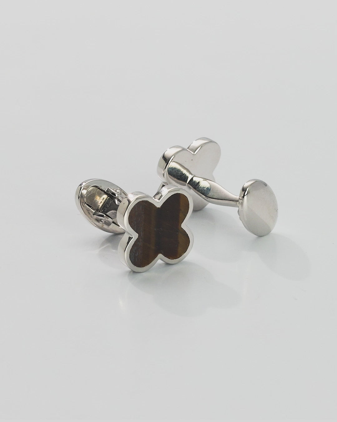 Video of a 360 degree view of the Four Leaf Clover Gemstone and Sterling Silver Cufflinks with tiger's eye inlay. 