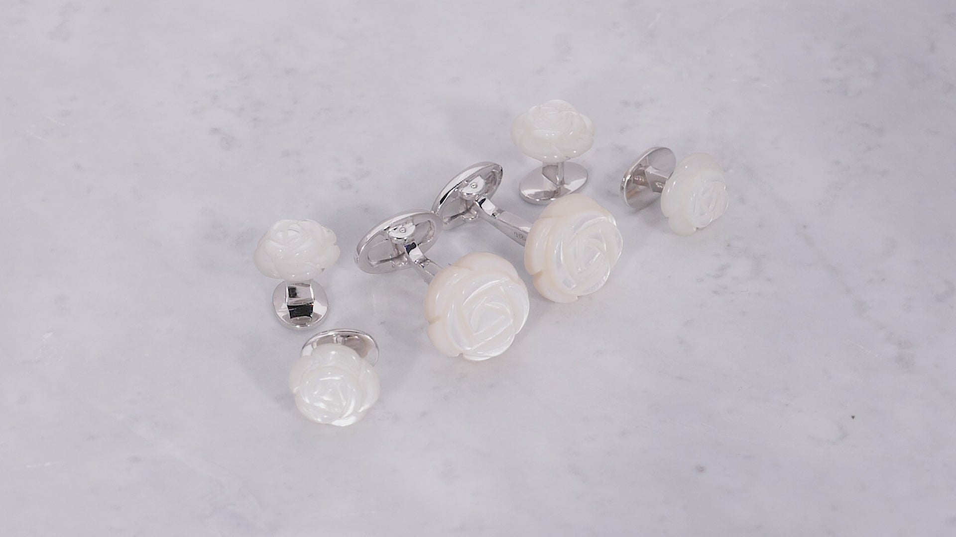 Video of Hand Carved Gemstone Rose Sterling Silver Cufflinks and Tuxedo Studs in mother of pearl. 