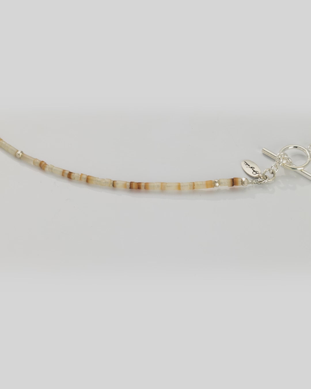 360 degree video of the Freshwater Pearl Center White Shell Beaded Necklace with Sterling Silver Accents. 