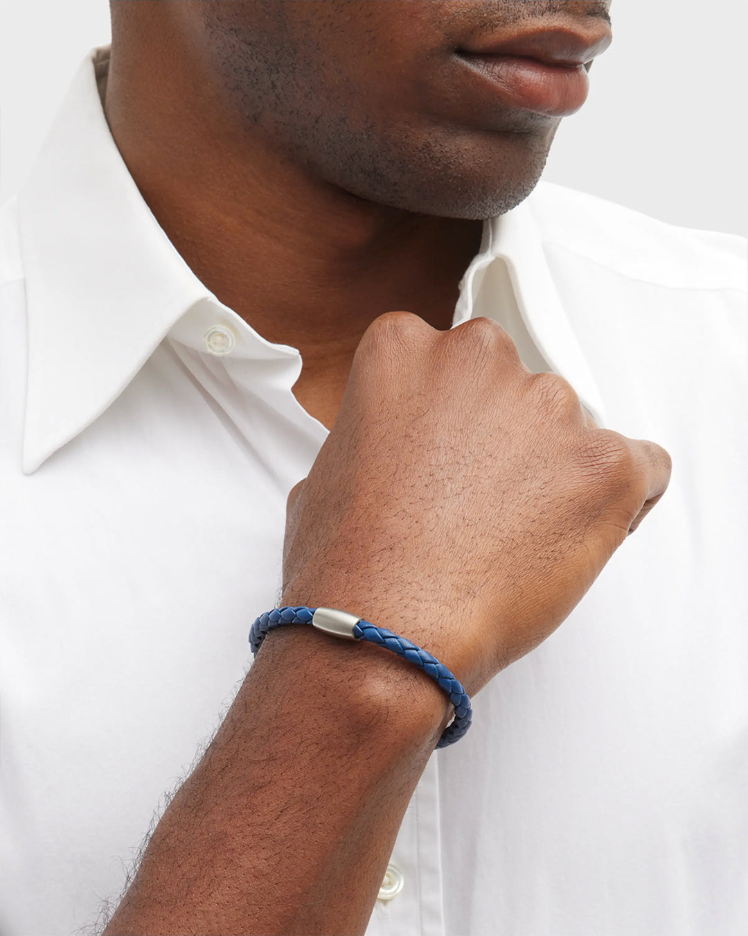 Close up of male models wrist donning the Jan Leslie Magnetic-5 Braid Royal Bracelet. 