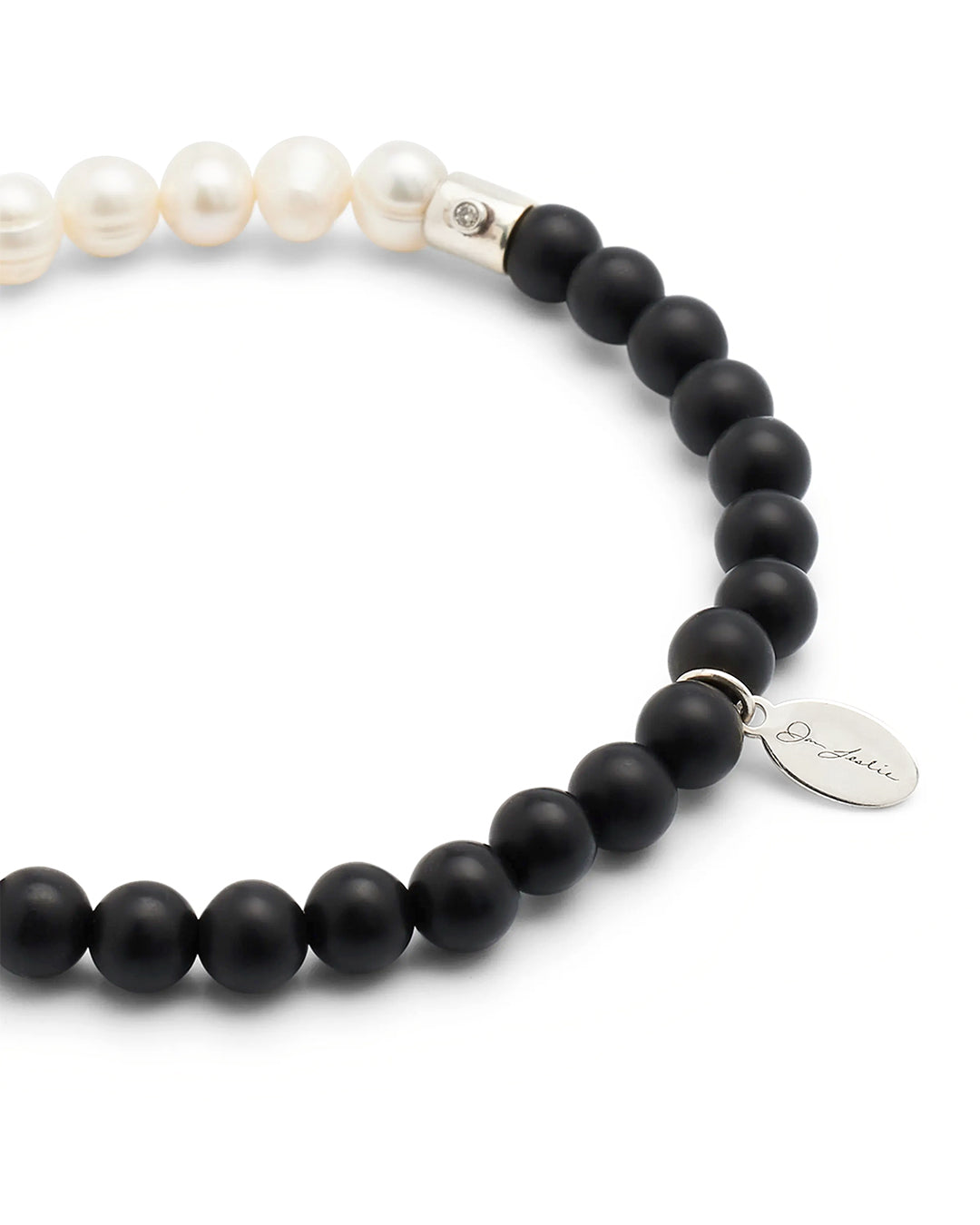 Close up of the black agate beads on the Men's Freshwater Pearl and Black Onyx Gemstone Split Beaded Bracelet. 