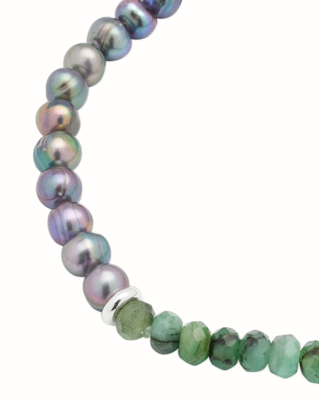 Close up of the faceted green emerald, freshwater pearl beads and sterling silver spacers. 