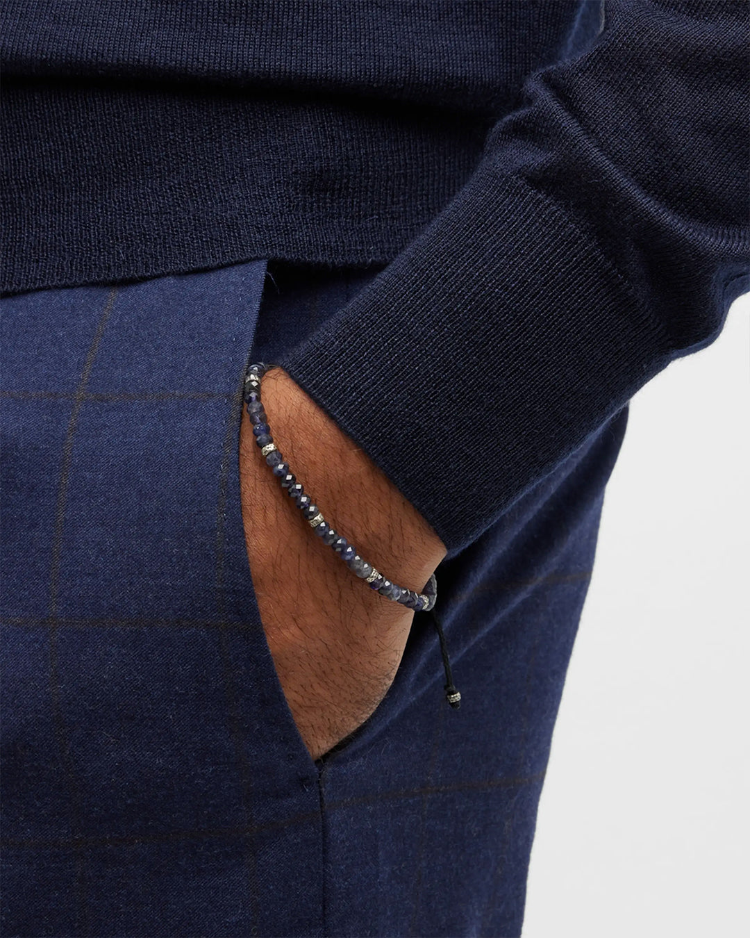 Close up of male models wrist donning the Jan Leslie Faceted Blue Sapphires Bracelet. 