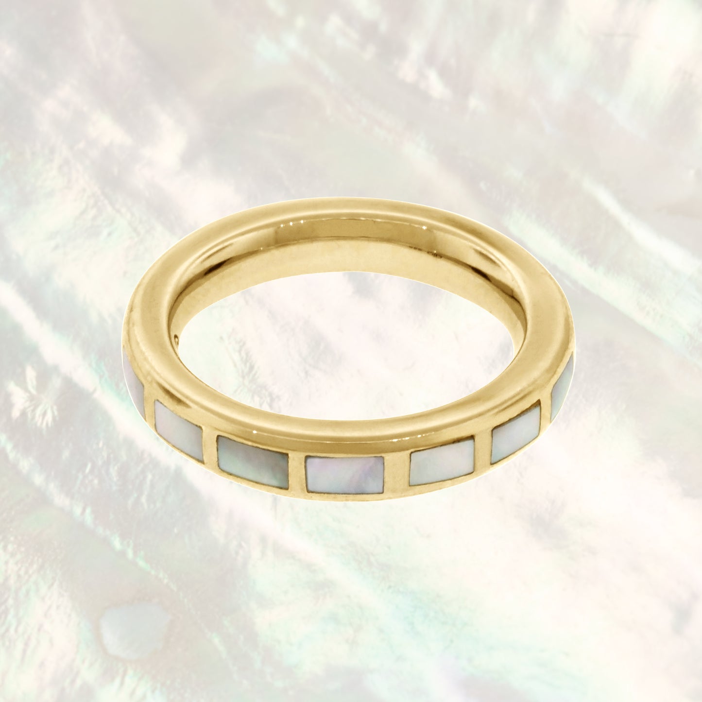 Dash Rectangle Gemstone Sterling Silver Stackable Ring in mother of pearl on gold on a mother of pearl background.