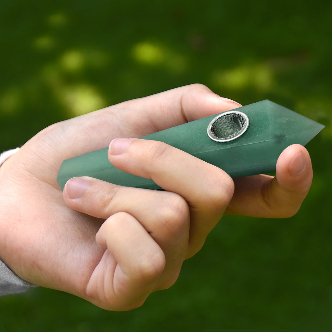 Model holding the Green Aventurine Gemstone Pipe - The Prosperity Stone.