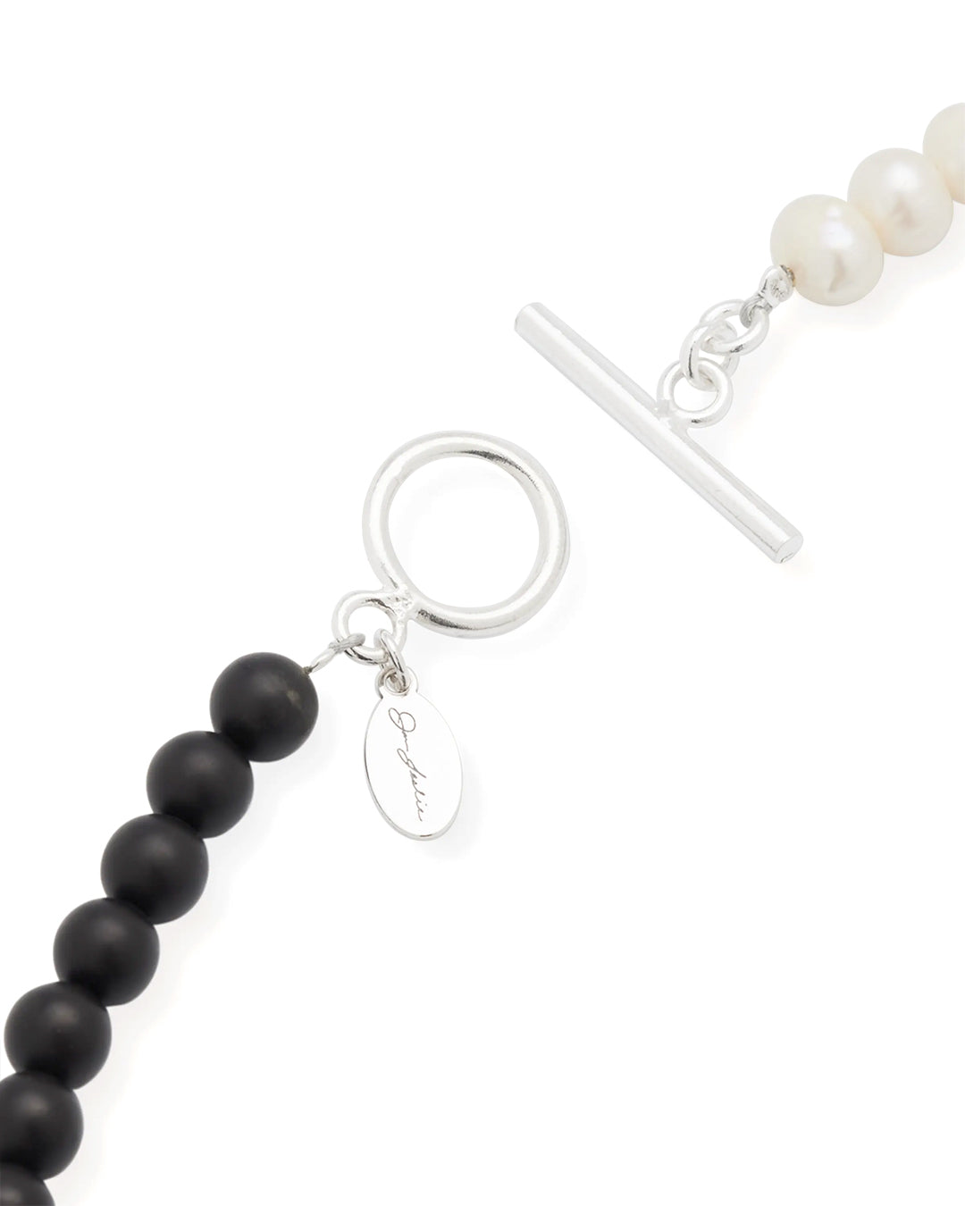 Close up of the sterling silver toggle closure, matte black agate beads and freshwater pearls. 