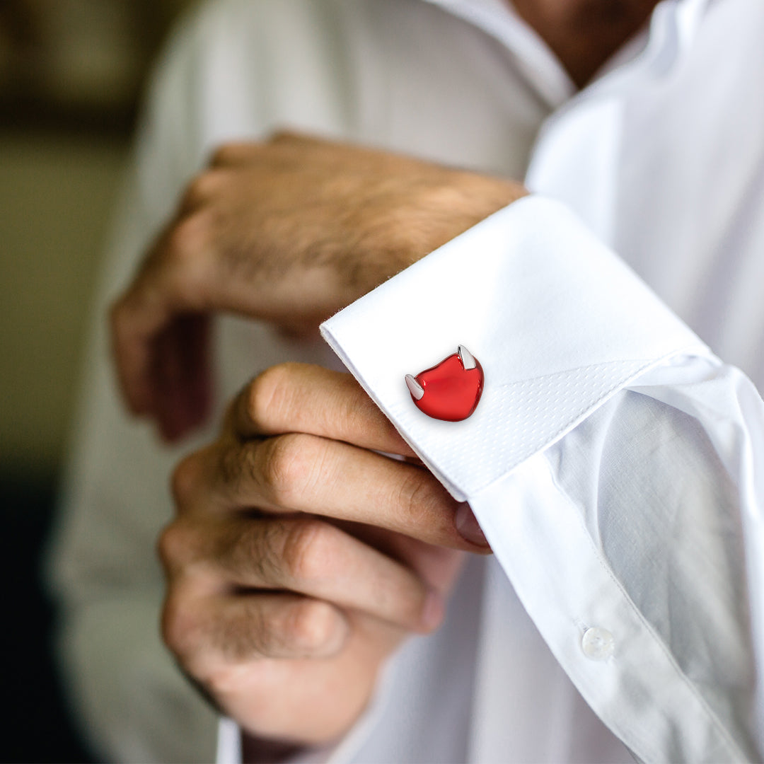 Photo of a Heart with Horns Sterling Silver Cufflinks on a white  cuff dress shirt. 