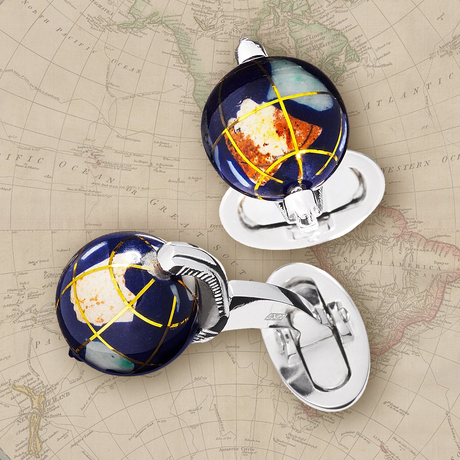 Spinning Lapis Globe with Semi-Precious Stone Inlay Sterling Silver Cufflinks on a map background. 