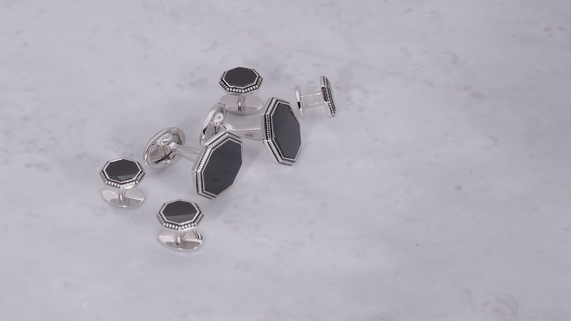 180 view of Jan Leslie's Octagon Gemstone with Antique Border Sterling Silver Cufflinks and Tuxedo Studs in black onyx. 