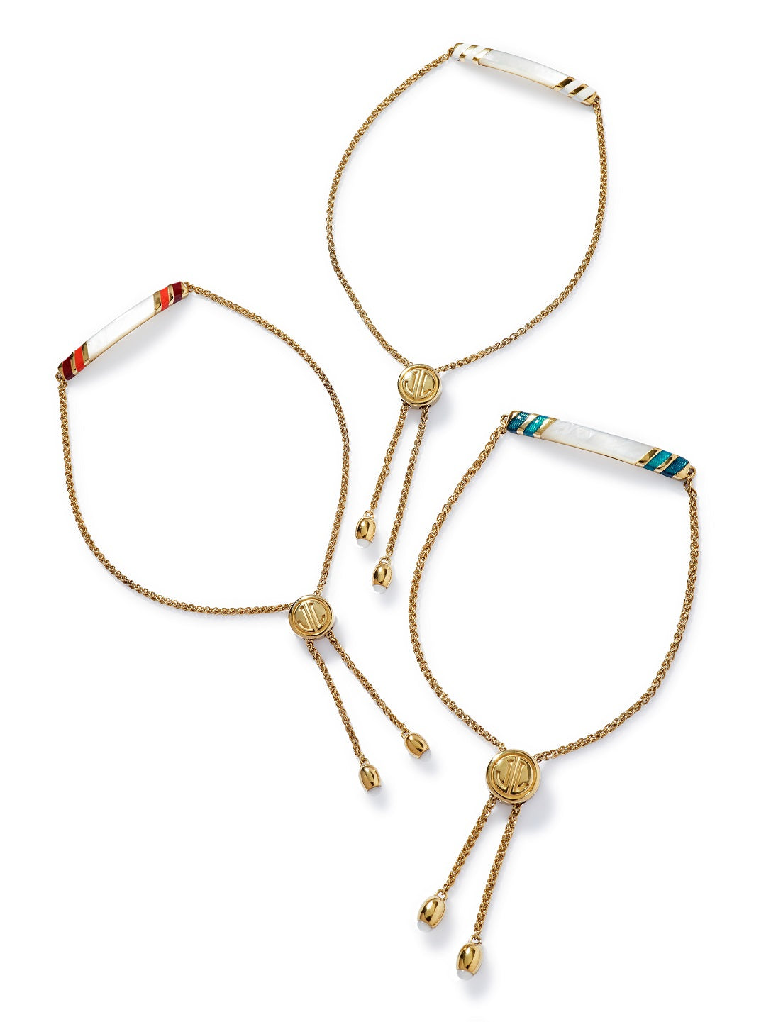 Group shot of the Stripe Enamel and Shell Gemstone Adjustable 18K Gold Vermeil Bolo Sterling Silver Bracelets in red on gold, white on gold, and blue on gold on a white background. 